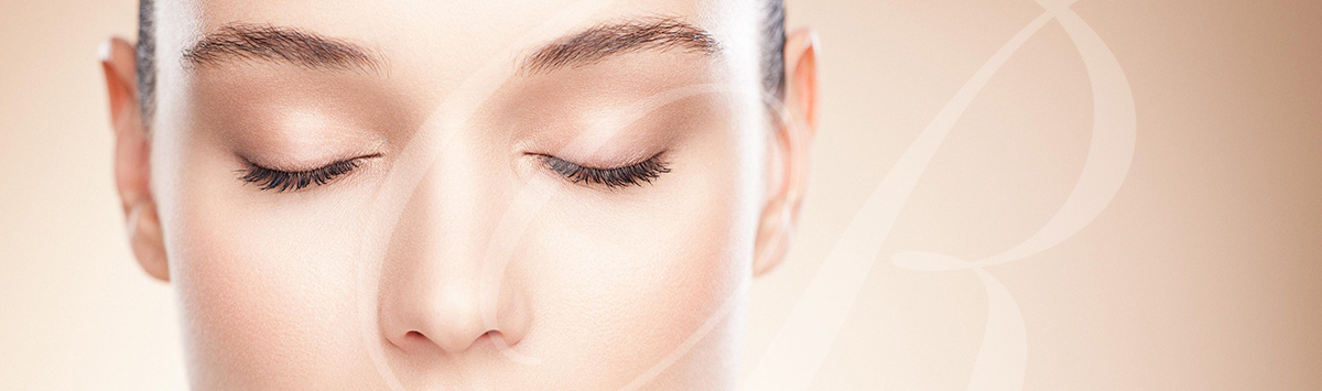 Partial view of woman's face with eyes closed
