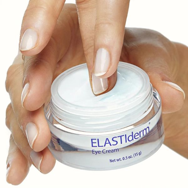 fingers dipping into container of ELASTIderm eye cream