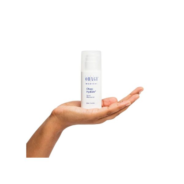 Obagi Hydrate Facial Moisturizer bottle in palm of hand