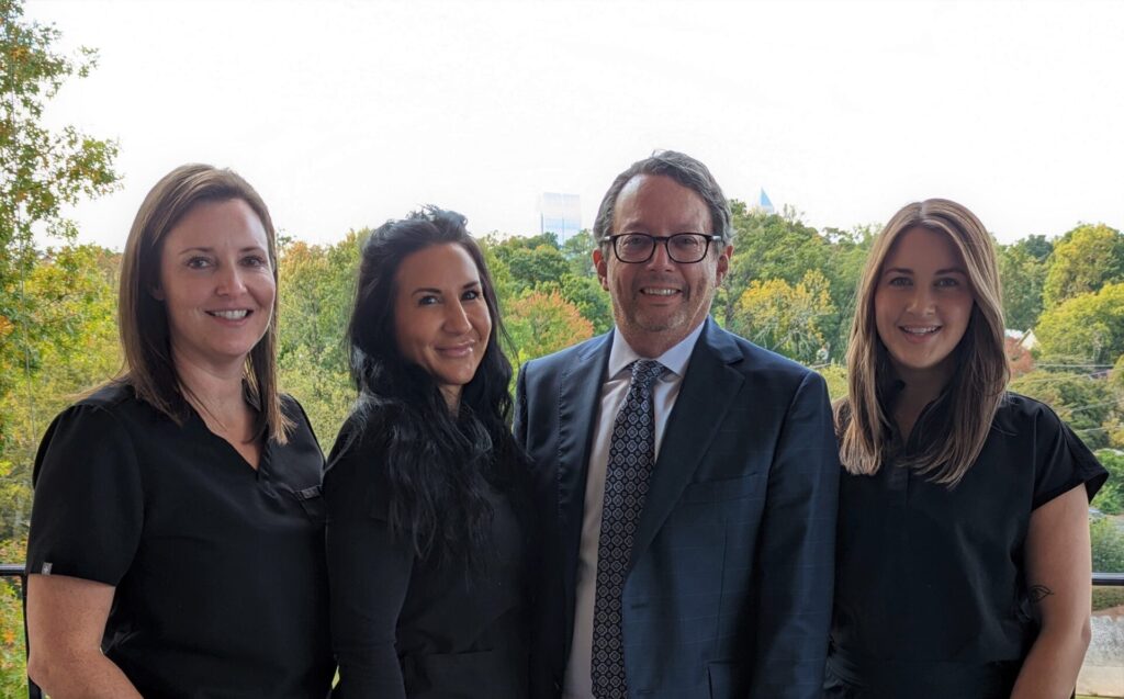 Dr Rudderman and Staff outside