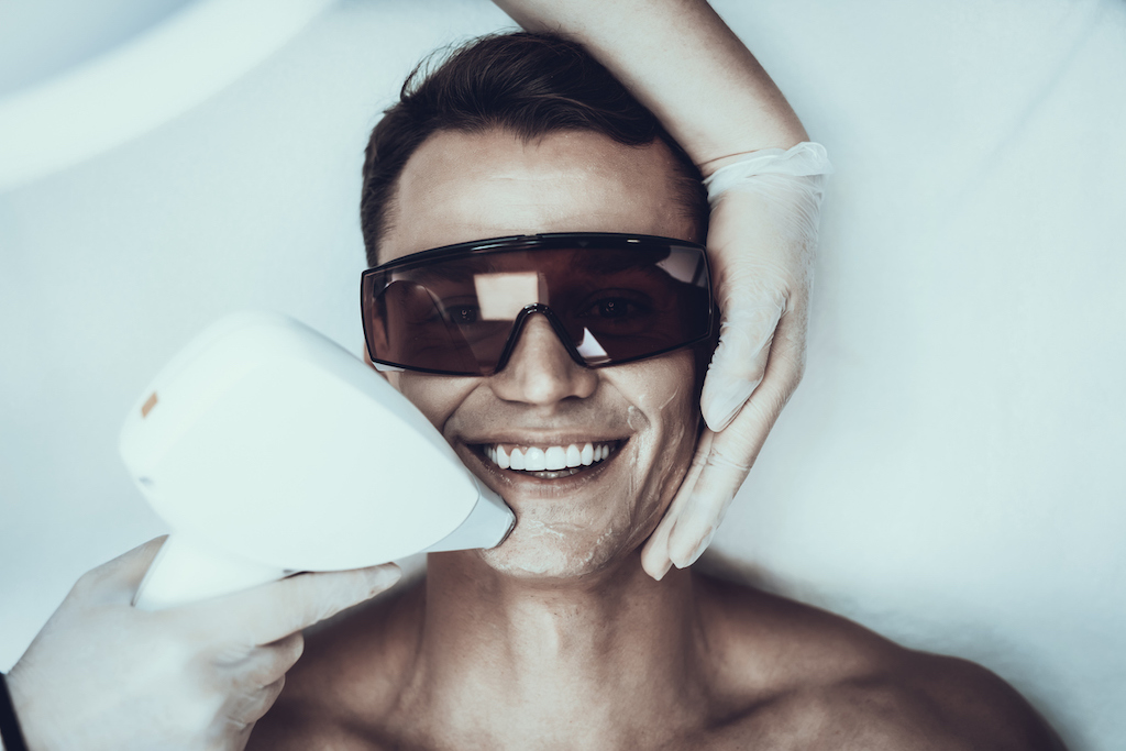 you male getting bbl laser treatment on face