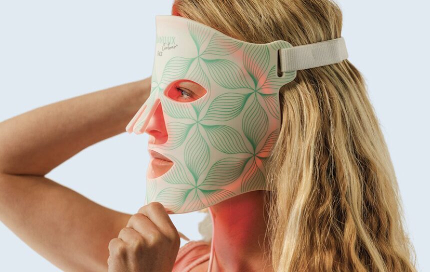 female wearing Omnilux Face mask while on